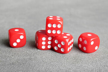 Red dices on grey background