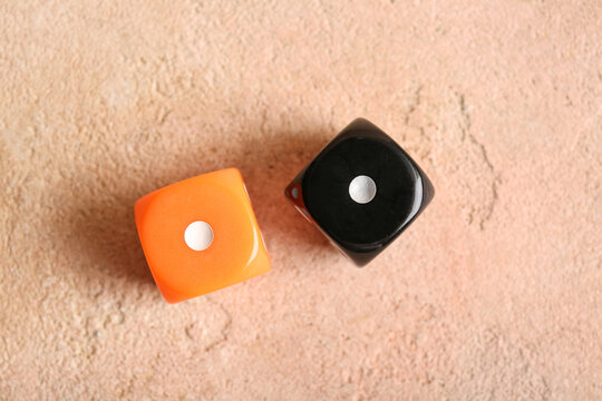 Different dices on beige background