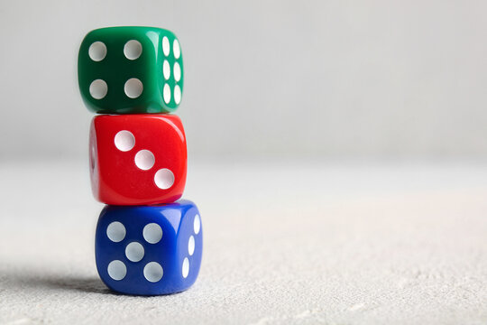 Different dices on light background