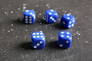 Blue dices on dark background