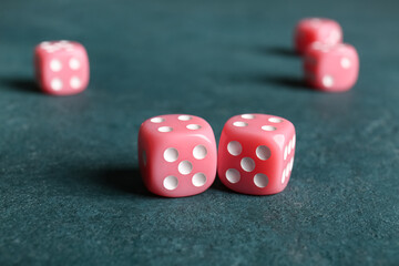 Pink dices on color background