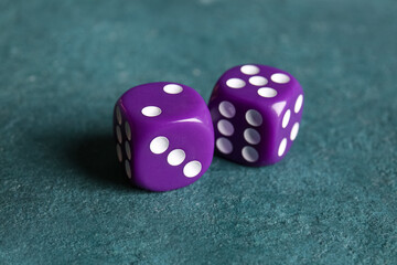 Purple dices on color background