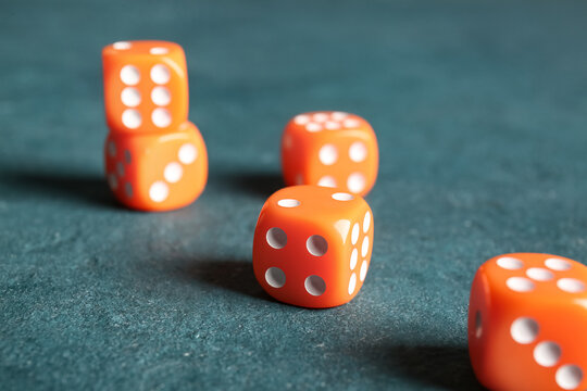 Orange dices on color background