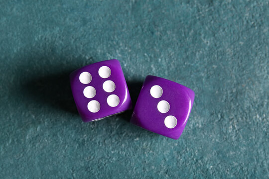Purple dices on color background