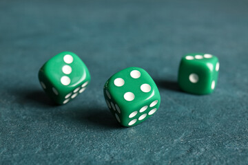 Green dices on color background