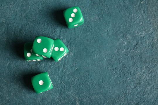Green dices on color background