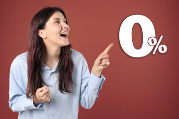 Zero commission. Happy woman pointing at 0 percent sign against dark red background
