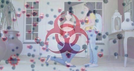 Kneeling woman adjusting schoolgirl backpack in home entryway, with red biohazard and virus overlay