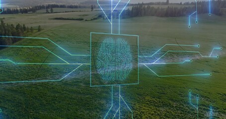 Displaying neon-blue digital circuit overlay tracing farmland aerial view, showing fingerprint node