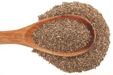 Detail of chia seeds in wooden spoon on white background