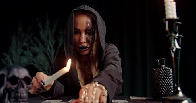 Witch casting spell with dagger over tarot spread