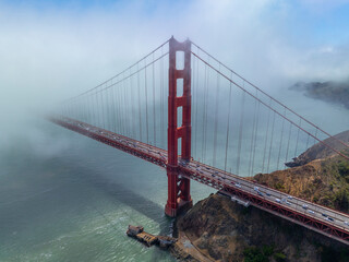 Golden Gate Bridge north tower in the fog at San Francisco Bay, city of San Francisco, California CA, USA. 