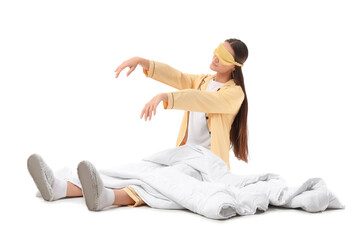 Female sleepwalker with blanket sitting on white background