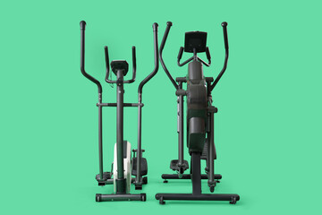 Elliptical machines on green background