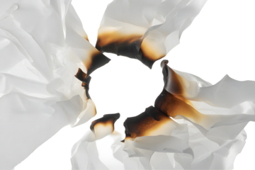 Burnt paper with a hole isolated on transparent background, closeup