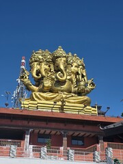 Beautiful Lord Ganesh statue standing in a very peaceful surrounding.