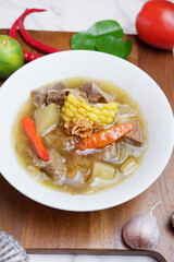 Tamarind Beans Beef Soup or Sayur Asem Asem Daging Sapi, a fresh and healthy homemade dish made from chickpeas, beef, red green chilies, and tomatoes. It's savory, spicy, salty, sweet and sour