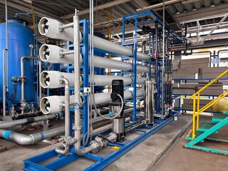 Large industrial Reverse Osmosis (RO) water treatment system with multiple pressure vessels, pipes,...