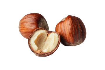 Hazelnuts on black two whole, one halved