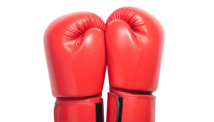 Two bright red boxing gloves are positioned closely together against a plain white backdrop, cutout