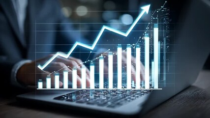 Business person analyzing financial data on laptop with growing bar graph overlay, 4k video - Powered by Adobe
