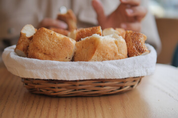 Freshly baked bread in a basket at a cozy cafe