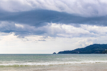 Patong Beach Phuket with turquoise blue water and mountains Thailand.