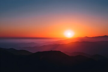 Fototapeta premium Sun Setting Behind Distant Mountain Range Layers Sunset Landscape Scenic Mountain Silhouette Natural Beauty