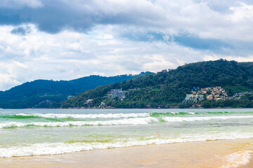 Patong Beach Phuket with turquoise blue water white sand Thailand.