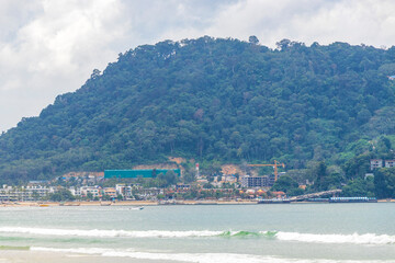 Patong Beach Phuket with turquoise blue water white sand Thailand.