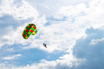 Patong Beach Phuket with parachute sport and parasailing activity Thailand.