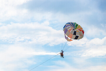 Patong Beach Phuket with parachute sport and parasailing activity Thailand.