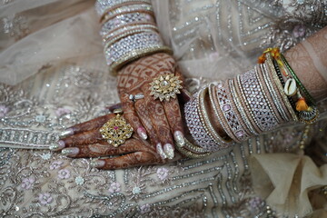 Indian bride's hands decorated with mehndi