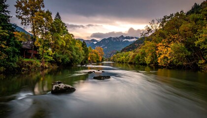Serene River Flowing Through Lush Green Forest at Dusk.