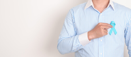 Man with blue Ribbon for concept of blue November, November Prostate Cancer Awareness month, World...