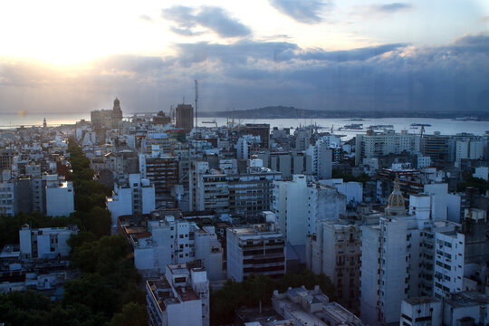 Montevideo city skyline with tall buildings and urban buildings at sunset