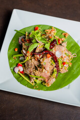 Delicious thai dish on plate with leaf decoration. This vibrant cuisine is a true feast for the senses, with its fresh ingredients, tantalizing aromas, and explosive flavors.