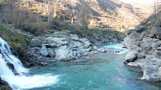 Drone flying past the Roaring Meg hydro scheme on the South Island of New Zealand