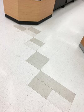 Poor Flooring Job, VCT Tiles Mismatched and Pieced Together