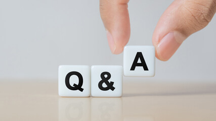 Hand holding Q and A word with dice cube. FAQ( frequency asked questions), Answer, Question Ask,...
