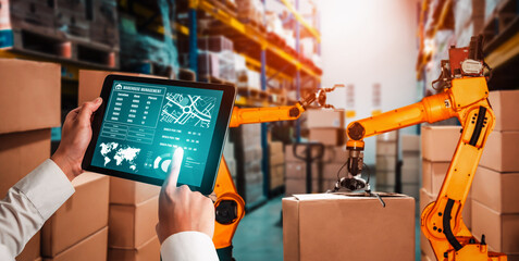 Smart robot arm systems for innovative warehouse and factory digital technology . Automation manufacturing robot controlled by industry engineering using IOT software connected to internet network .
