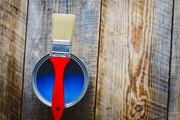 jar with blue paint and red brush top view