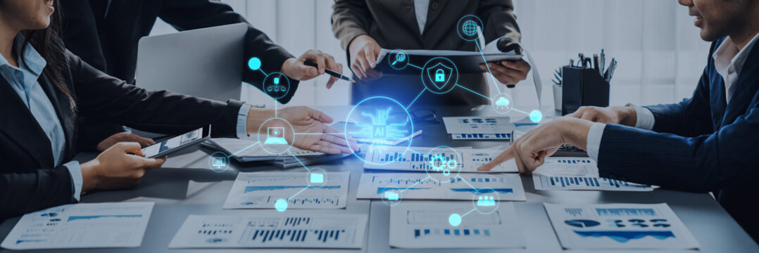 A team of business professionals engages in dynamic project analysis, utilizing digital tools to showcase data-driven insights and foster innovative collaboration in the office. Trope - Powered by Adobe