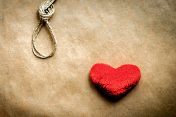 concept hangman knot with plush red heart