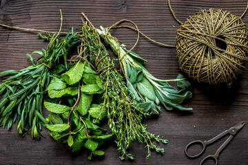 sage and thyme, mint, estragon on wooden background top view
