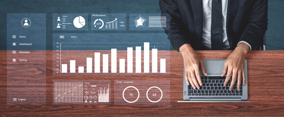 A businessman focusing on data analysis using a laptop with digital interface elements. The workspace features performance metrics, various charts, and statistics for effective decision-making. Impute