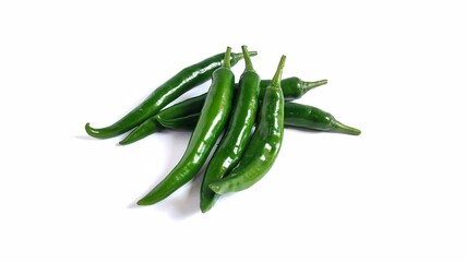 Green hot chili peppers isolate on white background with copy space. Clipping path. Perfect for design element, spicy food concept or any commercial usages.