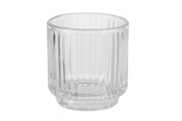 Empty transparent ribbed glass tumbler on white background