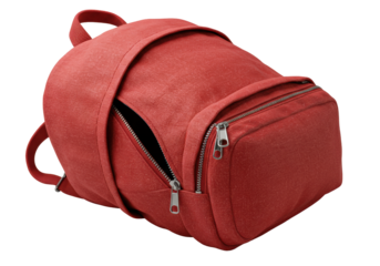 Bright red classic textile backpack, unzipped, padded interior visible, on transparent background, extreme macro low-angle product photo with raking spotlight, high-end durability and craftsmanship