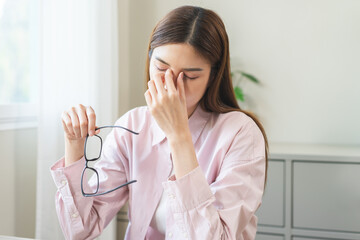 Eye problem concept, fatigue asian young woman tired eyes irritated rubbing, massage nose, relief...